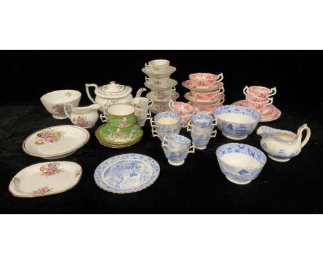 A mid 19th century English porcelain part tea service, decorated with flowers, comprising teapot and stand, cream jug, slop b