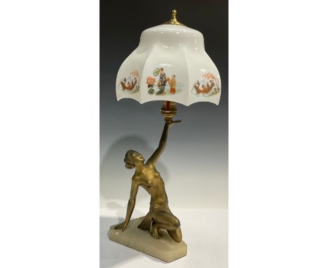 An Art Deco table lamp, modelled as a scantily clad female raising the shade aloft, 46cm high 