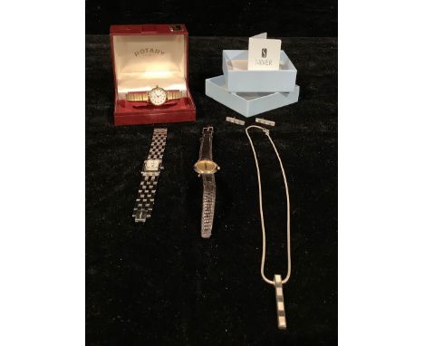 A lady's Rotary watch, boxed; a lady's Gucci watch; a lady's stainless steel DKNY watch; a sterling silver suite, comprising 