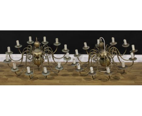 A pair of Dutch design brass twelve-light electroliers, approximately 98cm diameter (2) 