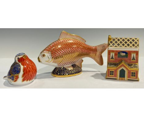 A Royal Crown Derby paperweight, Robin, gold stopper; another, Carp, silver stopper; a Royal Crown Derby miniature model, The