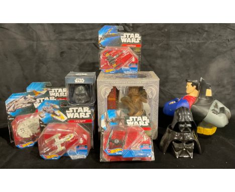 A Mattel Hot Wheels die-cast Star Wars model, Millennium Falcon, blister packaged; others, First Order Tie Fighter, Poe's X-W