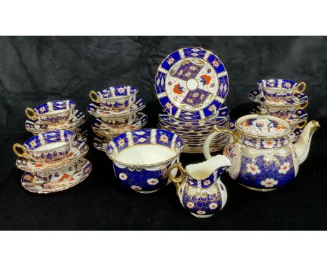 A Staffordshire Imari tea service, cups, saucers, tea bowl, etc (qty) 