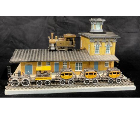 A miniature model train station, Gettysburg, complete with train and coaches, 28cm wide; a Japanese Fulgurex KMJ brass miniat