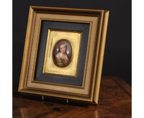 A 19th century Continental porcelain portrait plaque, painted with a young girl in a green shawl, oval, 8cm x 6cm, gilt frame