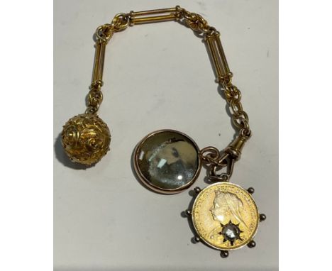 A late 19th century fob chain, unmarked, spherical fob, fancy link chain, gilded silver thre'penny bit with paste stone, with