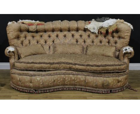 An early 20th century kidney shaped sofa, deep-button back, squab cushion, 89.5cm high, 190cm wide, the seat 145cm wide and 5