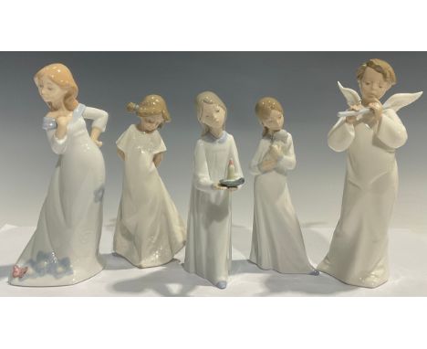 A Nao Lladro figure of a young girl holding a puppy, 20cm high; a Nao Llado figure of a young girl with her arms behind her b