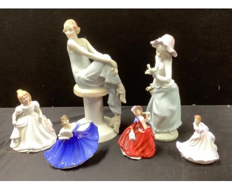 A Royal Doulton figure, Flirtation, HN3071; others, Amanda, HN2996; Elaine, HN3214; Autumn Breezes, HN2176; Ninette HN3215; a