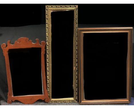 A Victorian style oak vauxhall looking glass, 84.5cm high; a rectangular looking glass, bevelled mirror plate, 95cm high; a r