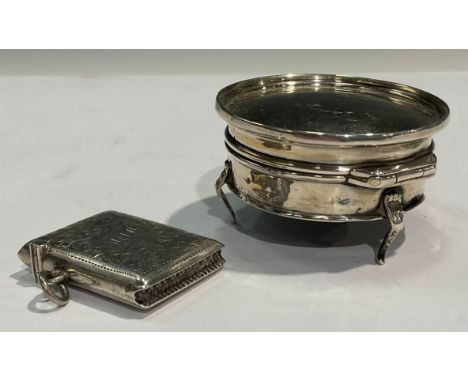 A George V silver circular trinket pot and cover, resting on three cabriole legs, 6.75cm diameter, Birmingham 1917; a George 
