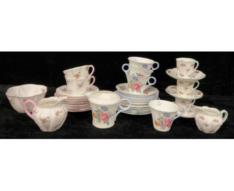 A Shelley Bridal Rose part tea service comprising cream jug, sugar bowl, side plates, cups and saucers; other Shelley part te