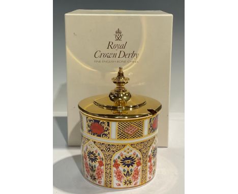 A Royal Crown Derby Imari 1128 pattern cylindrical preserve pot, gilt metal cover with finial, 10.5cm, first quality, boxed 