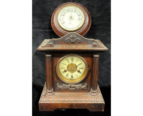 An oak mantel clock; a circular wall barometer (2) 