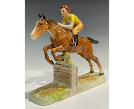 A Beswick model horse group, girl on a jumping horse/lady showjumper, number 939, 25cm 