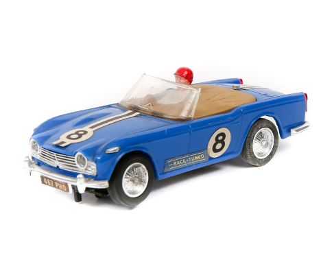 A 1960’s Scalextric ‘Race Tuned’ series Triumph TR4A. An example in blue with tan tonneau, RN8, driver with red helmet. VGC. 