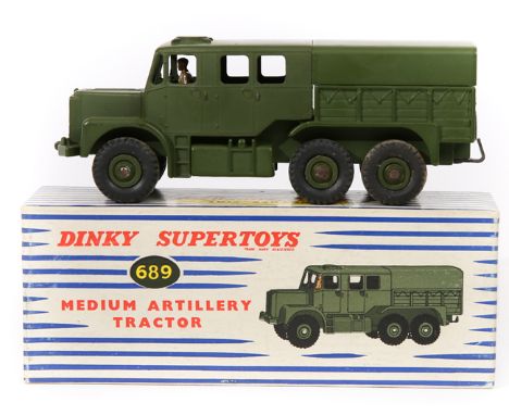 Dinky Supertoys Medium Artillery Tractor (689). In olive green, complete with tin tilt.  Boxed. Vehicle Mint. Inside back cov