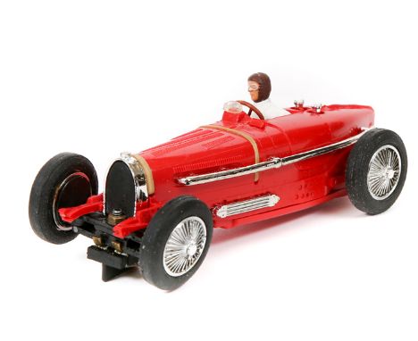 A rare original issue Scalextric Bugatti Type 59. An example in bright red with driver in white with brown helmet. Mint, look