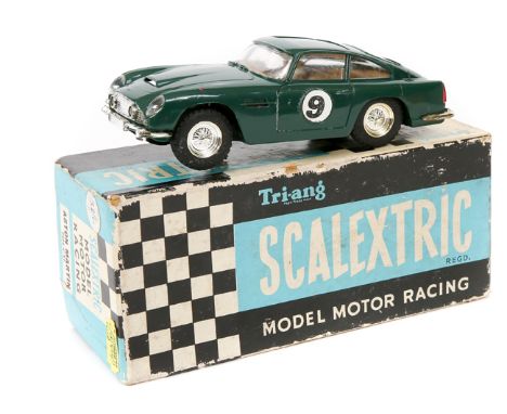 A scarce 1960’s Scalextric Aston Martin DB5 (MM/C.57). In British Racing Green with light brown interior, RN9. Boxed, some ag