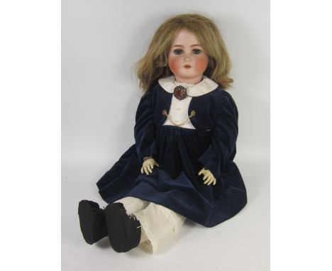 Large bisque headed child doll with blue sleeping eyes and open mouth, marked K& R Simon & Halbig 80, on a ball jointed compo