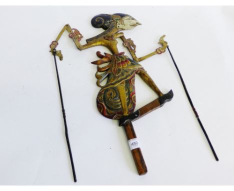 A late 19th / early 20th Century carved hardwood and hand painted shadow puppet, modelled as an eastern female figure 