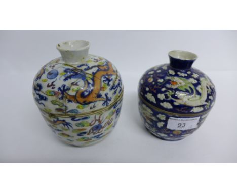 Two Chinese Qing porcelain rice bowls with covers, each painted with dragon chasing pearl patterns to a blue and white ground