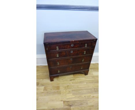 A 19th century mahogany bachelor's chest having a flip top over four graduating drawers raised on bracket feet, 77 x 84cm