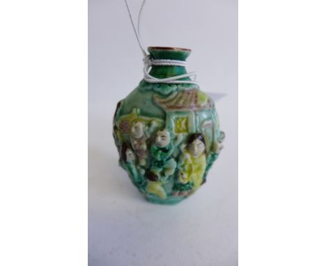 Chinese green glazed scent flask with figures in relief