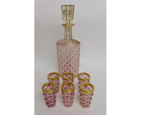 19th century ruby and clear glass hob nail cut decanter with gilt decorated stopper and set of six matching shot glasses (7)