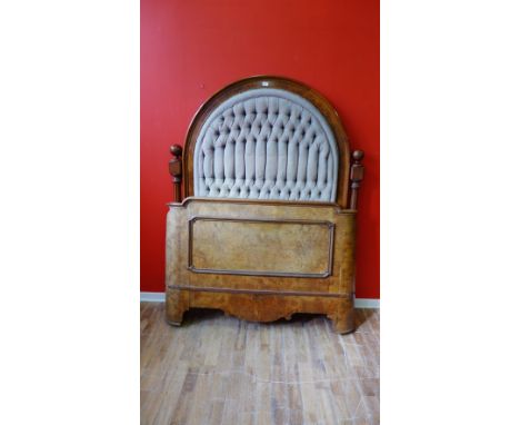 A 1920s mahogany and burr walnut framed double bed having a dome topped button back headboard and a moulded bed end