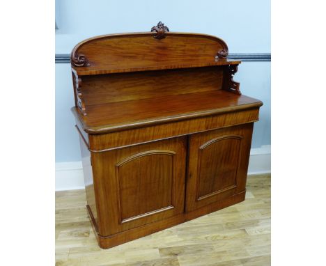 A 19th Century mahogany chiffonier having a moulded ledgeback with shelf, raised on pierced supports,over long drawer and pan