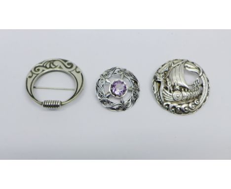 Robert Allison of Iona Scottish silver Viking longboat circular brooch together with an Edinburgh silver and amethyst set bro