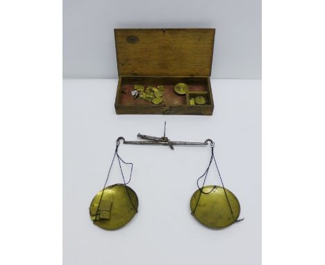 Cased set of brass coin scales