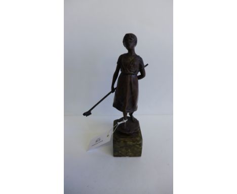 Schmidt - Felling bronze figure of a young girl modelled standing with a rake behind her back, raised on rectangular marble b