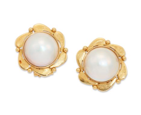 A pair of mabé pearl earrings, the mabé pearls collet set with floral design surround, with post and clip fittings, Cyprus as