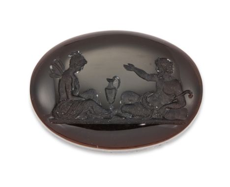 An unmounted onyx intaglio, depicting Pan and Psyche, with two drill holes to the reverse, measuring 28 x 20 x 5mm Condition 