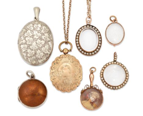 A group of assorted period locket pendants, comprising: a late 19th century gold hinged locket pendant with engraved decorati