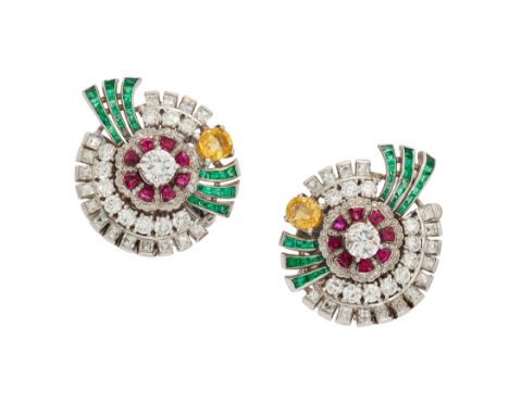 A pair of diamond, ruby, emerald, and yellow sapphire clip-on earrings, each composed of a central brilliant-cut diamond, eac