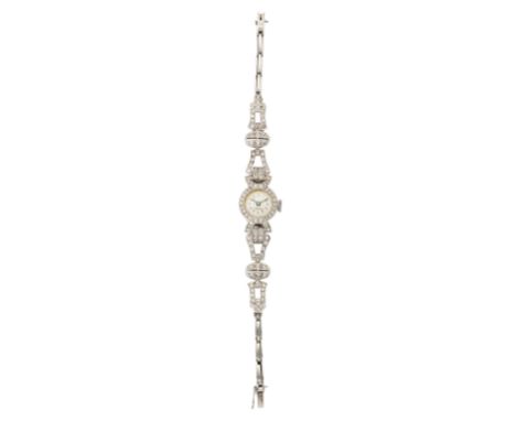 Swiss. A  manual wind platinum diamond set cocktail watch  17 jewel manual wind movement, silvered dial with printed Arabic n