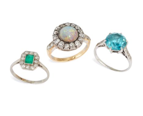 A group of three gem-set rings, comprising: an opal and diamond cluster ring, ring size J½; a zircon and diamond ring, ring s