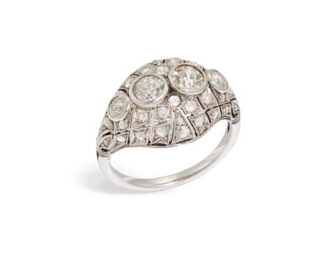 An Art Deco domed diamond ring, composed of four collet-set old-cut diamonds, with single-cut diamond set domed surround, cir