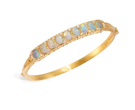 An 18ct gold opal and diamond hinged bangle, the upper half with a row of oval cabochon opals with brilliant cut diamond poin