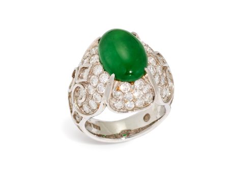 An apple green jadeite jade and diamond bombé ring, with central jade cabochon, measuring approximately 9.4 x 14 x 3.9mm, wit