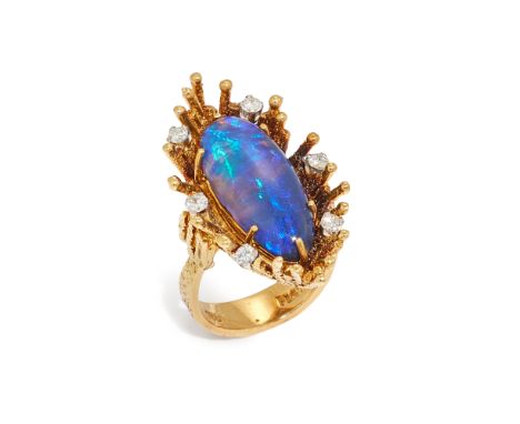 A black opal and diamond dress ring, the oval cabochon black opal in claw setting, to textured wire surround, with round bril