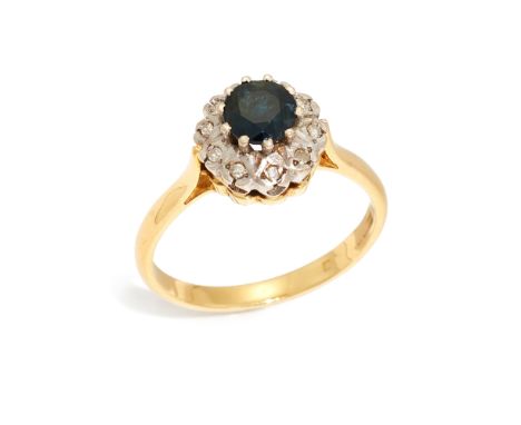 An 18ct gold sapphire and diamond cluster ring, the circular mixed-cut sapphire with single-cut diamond surround, to plain ho