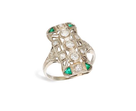 An early 20th century diamond and emerald ring,&nbsp;the pierced panel set with brilliant cut and single cut diamonds, and wi