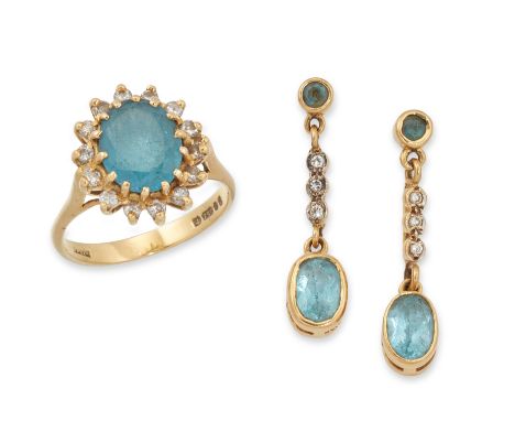 An 18ct gold blue topaz and diamond ring and earrings, an oval mixed cut blue topaz within brilliant cut diamond surround, to