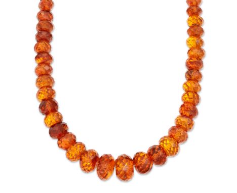 A graduated amber bead necklace,&nbsp;the facetted cognac amber beads, approximately 9.5 to 19.5mm wide, strung plain, length