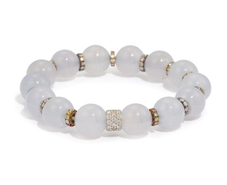 A jadeite jade bead bracelet, with diamond and coloured diamond set spacers, strung on elastic, inner diameter 5cm  Please no