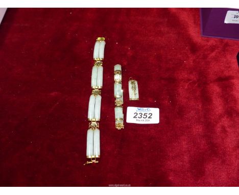 A 14k yellow gold and jade Bracelet, a 9K gold and jade Bracelet and a 9K yellow gold and jade pendant.